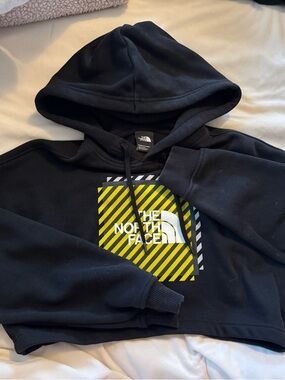 The North Face Black Hoodie with Yellow Accent Graphic
